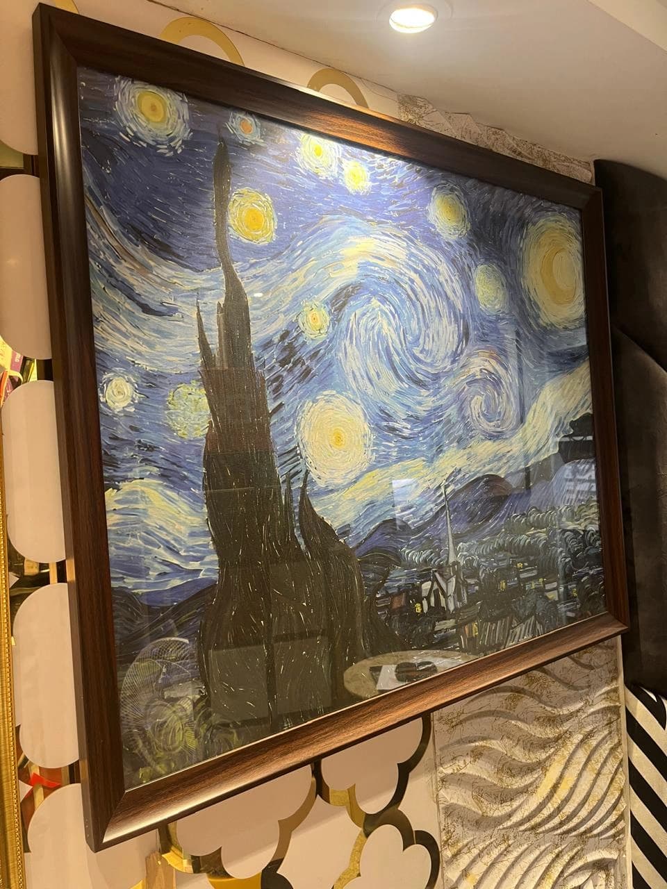 Framed canvas print sample with protective glass