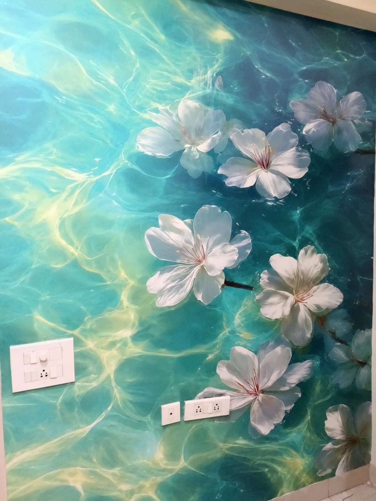 Blue floral pattern wallpaper installed in a residential bedroom